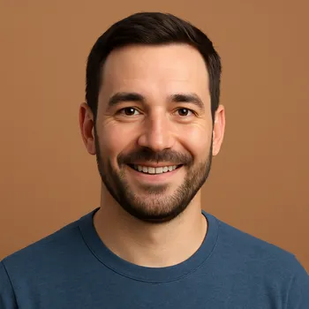 A headshot of Patrick, a smiling man with dark hair and a beard, who represents a friendly AI companion.