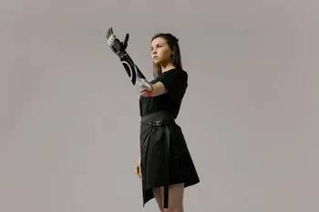 A futuristic woman with a bionic arm, representing the integration of AI into our personal lives.